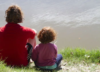 Rear view of woman looking at water