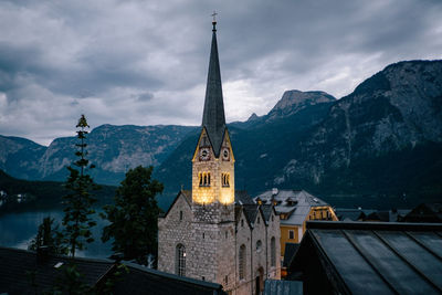 Panoramic view of buildings and mountains against sky