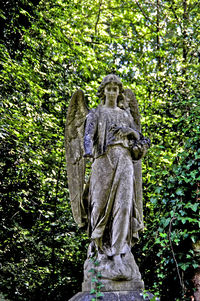 Low angle view of statue in forest