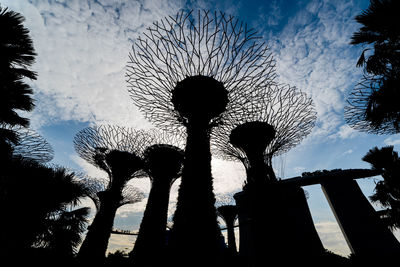 Low angle view of silhouette birds against sky