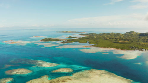 Tropical islands with beaches and azure coral reef water from above. bucas grande