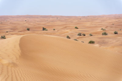 Scenic view of desert against clear sky