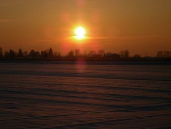 Scenic view of landscape at sunset