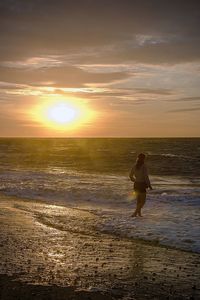 Scenic view of sea at sunset