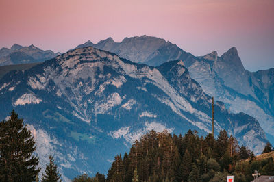 Scenic view of mountains against sky during sunset