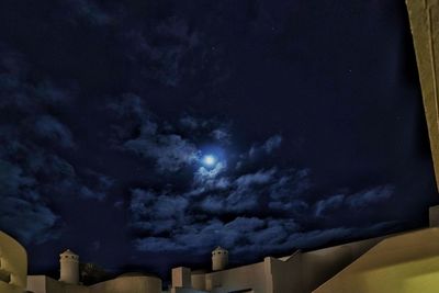 Low angle view of moon against sky at night