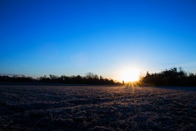 Scenic view of landscape at sunset