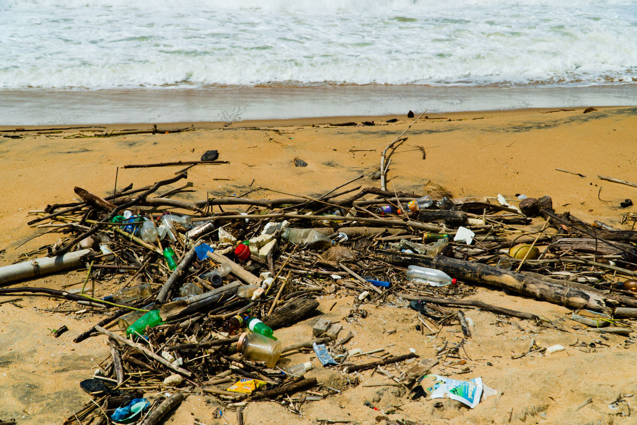 land, beach, water, sea, sand, pollution, nature, garbage, day, environmental issues, coast, no people, water pollution, shore, environment, body of water, bottle, wave, outdoors, abandoned, sunlight, environmental damage, messy