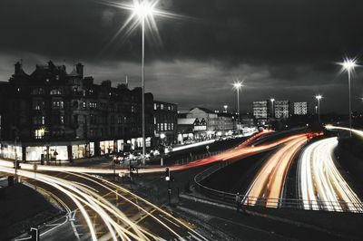 Light trails on street in city at night