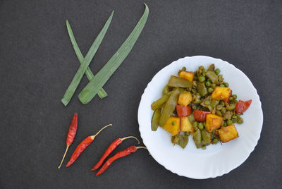 High angle view of vegetables in plate on table