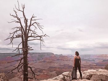 Rear view of woman standing at grand canyon national park