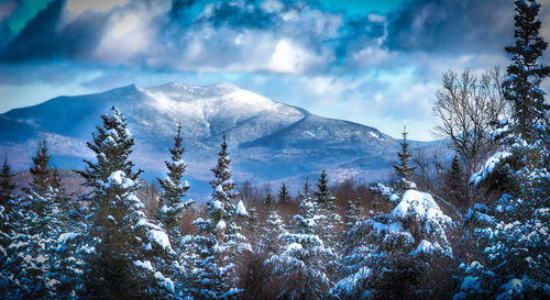 Scenic view of snowcapped mountains against sky