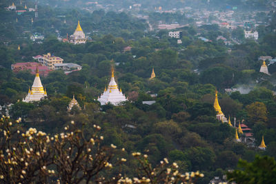 High angle view of pagoda amidst trees and buildings