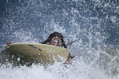 Man surfing on sea