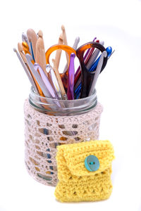 Close-up of multi colored pencils against white background