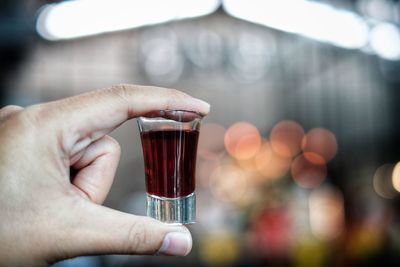 Close-up of hand holding drink