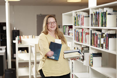 Portrait of librarian holding a book