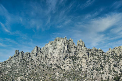 Low angle view of rocks against sky