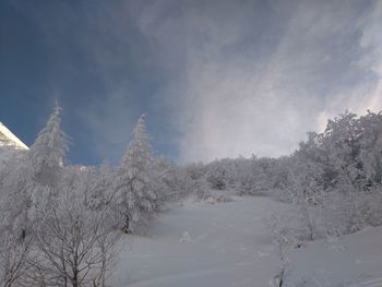 Scenic view of snowcapped mountains against sky