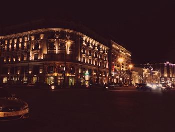 View of illuminated street lights at night