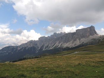 Scenic view of mountains against cloudy sky