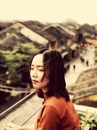 Close-up of young woman looking away