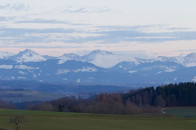 Scenic view of snowcapped mountains against sky