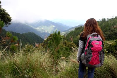 Rear view of woman looking at mountains