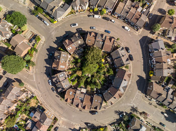 High angle view of buildings in town during sunny day