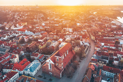 High angle shot of townscape against sky at sunset