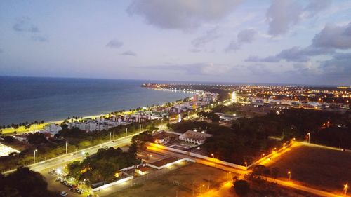 High angle view of illuminated cityscape against sky