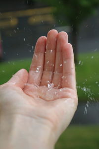 Water falling on hand