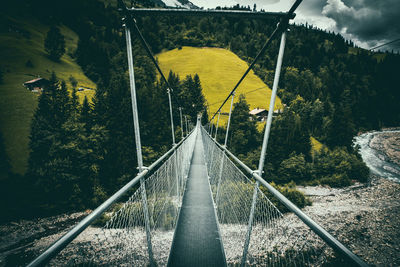 Footbridge leading towards mountains