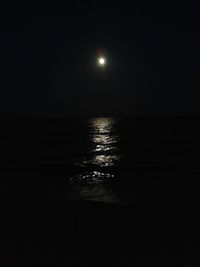 Scenic view of sea against sky at night