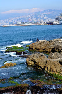 Scenic view of sea against sky on sunny day