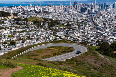 High angle view of road amidst buildings in city