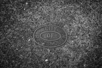 High angle view of manhole on field