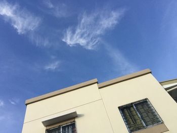 Low angle view of building against blue sky