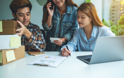 Business colleagues working at office