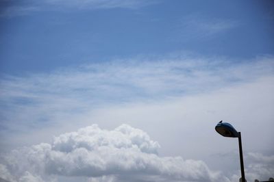 Low angle view of street light against sky