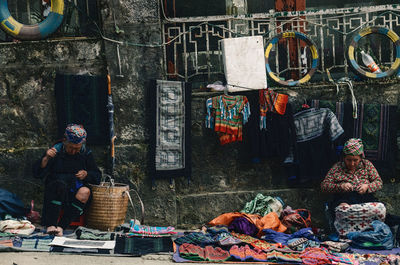 People working at market stall