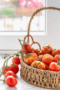 Close-up of tomatoes in basket on table