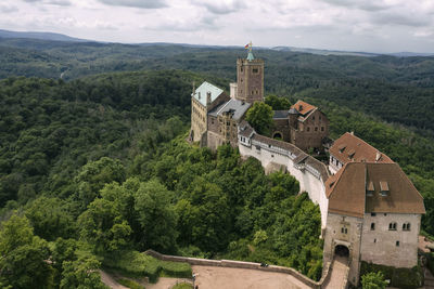 Panoramic view of trees and buildings against sky