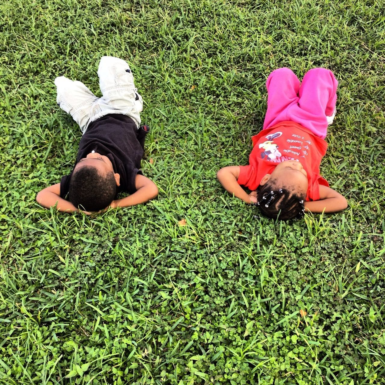 grass, shoe, grassy, field, high angle view, low section, lifestyles, leisure activity, green color, person, childhood, footwear, standing, men, casual clothing, lawn, growth, day