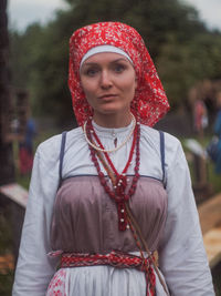 Portrait of woman wearing traditional clothing while standing outdoors