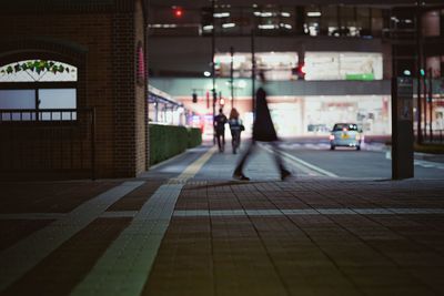 Rear view of woman walking in corridor