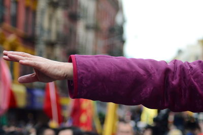 Close-up of person hand holding purple outdoors