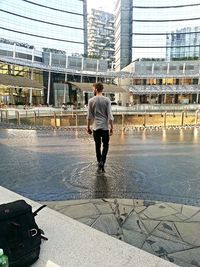 Woman standing on city street