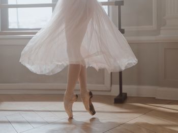 Low section of woman standing on floor