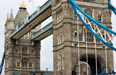 Low angle view of tower bridge against sky